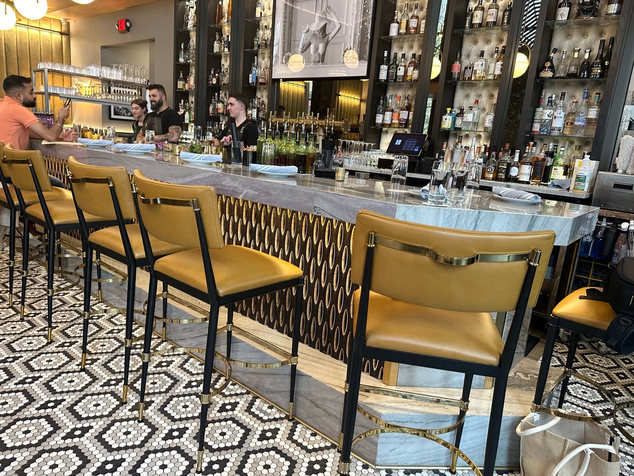 Restaurant bar with patterned flooring and high seating
