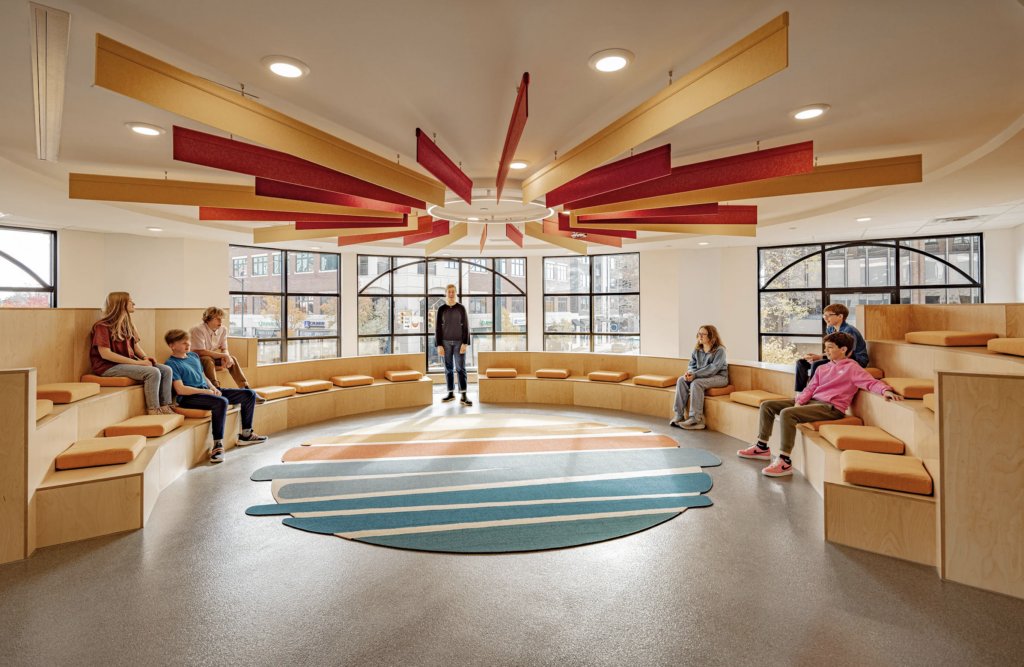 Educational or public space with colorful ceiling panels and seating